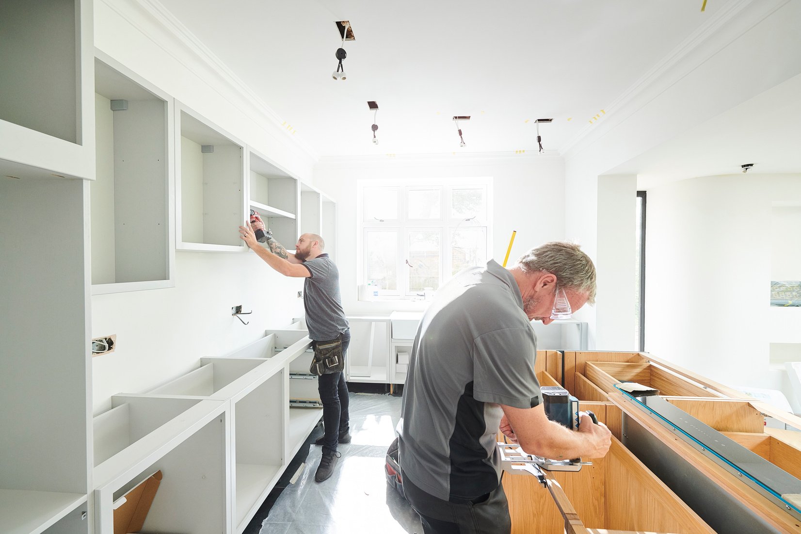 joinery team fitting a kitchen